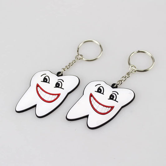 Airgoesin 100pcs Keychain Key Ring Hang Rubber Tooth Smile Shape Dental Clinic Gift Christmas Holiday Charms for Kids Birthday Party Favors & School Carnival Prizes